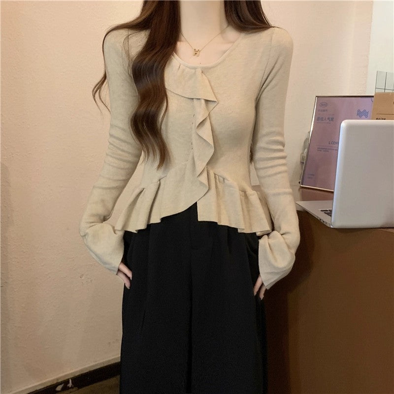 ベルスリーブペプラムニット