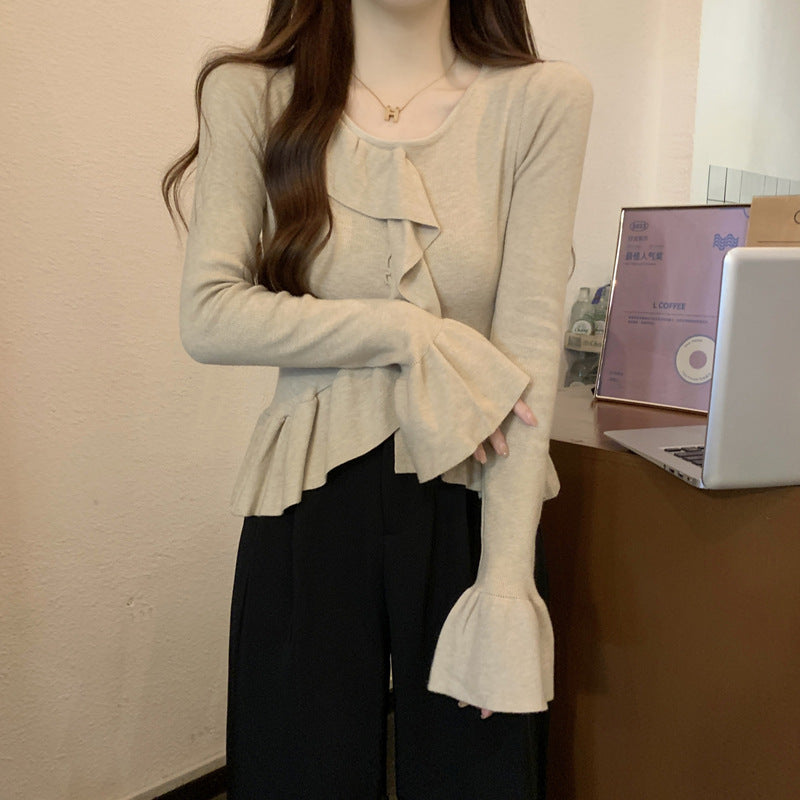 ベルスリーブペプラムニット