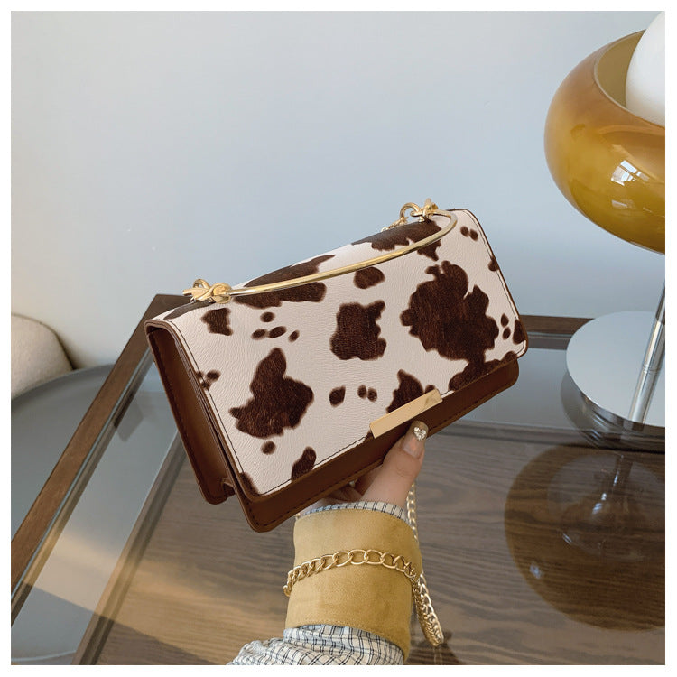 カウパターンチェーンミニバッグ