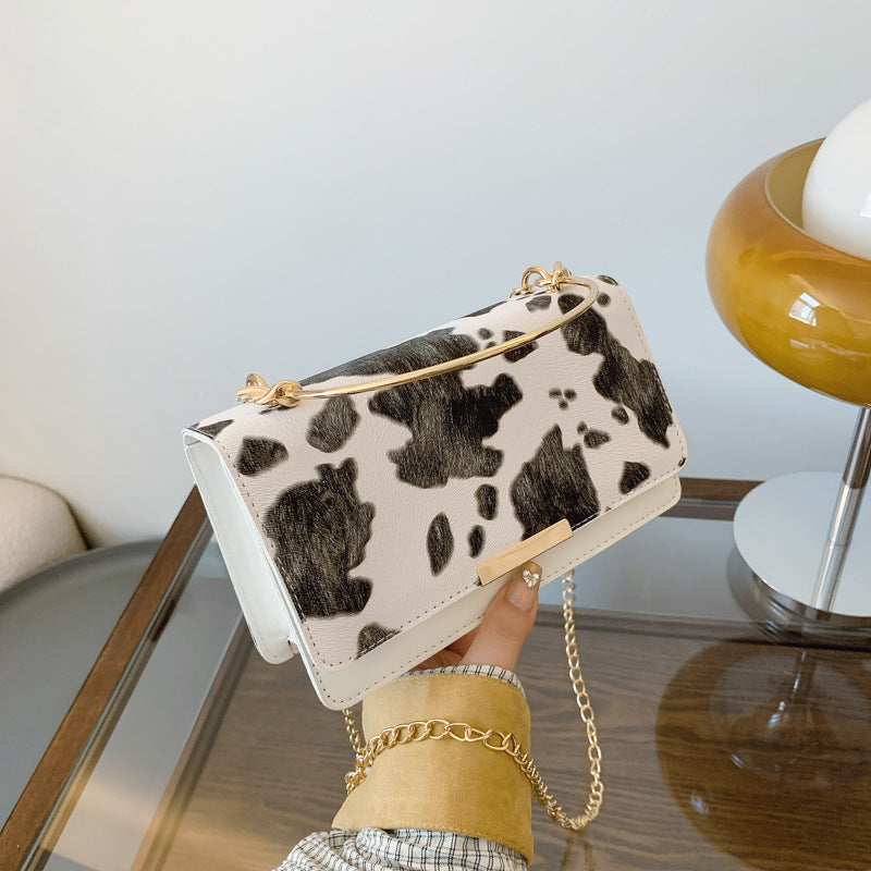 カウパターンチェーンミニバッグ